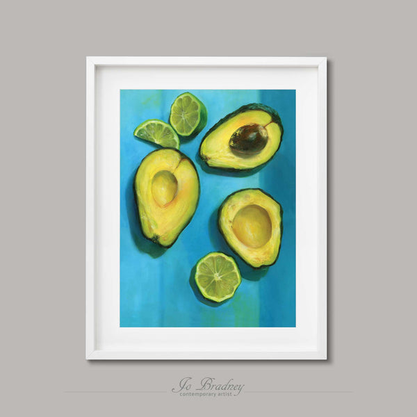 Creamy yellow avocado and green limes on a bright striped turquoise background. This archival art print of my vegetable still life oil painting is shown in simple white picture frame.