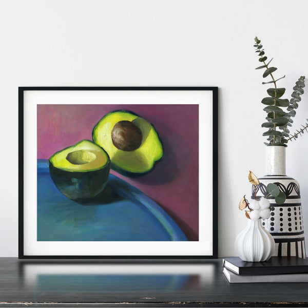 A bright avocado oil painting art print framed in a simple, elegant black picture frame on a dining room or living room wall. There are flowers in vase, set on a wood buffet table. The smallest print on paper is 4x6 inches, the largest is 11x14 inches.