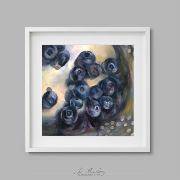 Fresh summer blueberries, washed and draining in a silver colander. This archival art print of my fruit still life oil painting is shown in simple white picture frame.