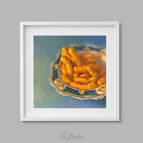 Orange Cheetos Cheese Puffs in an elegant blue porcelain bowl. This archival art print of my snack food still life oil painting is shown in simple white picture frame.
