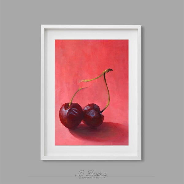 A bright pink and burgundy red cherry art print. This archival art print of my fruit still life oil painting is shown in simple white picture frame.