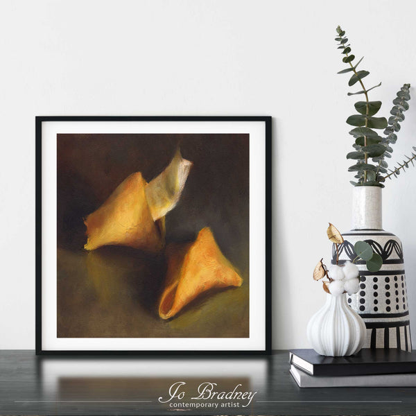 A fortune cookie oil painting giclee art print framed in a simple, elegant black picture frame on a dining room or living room wall. The smallest square print on paper is 4 inches, the largest is 12 inches.