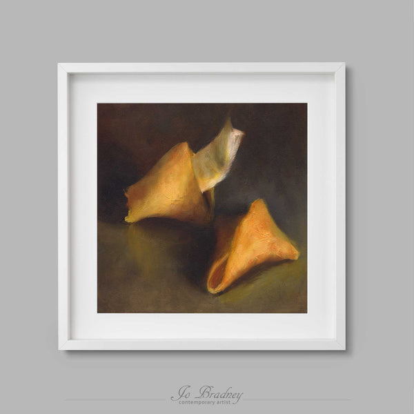 A golden Chinese fortune cookie, cracked to show the meaasge inside. This is a square archival art print of my snack food still life oil painting is shown in simple white picture frame.