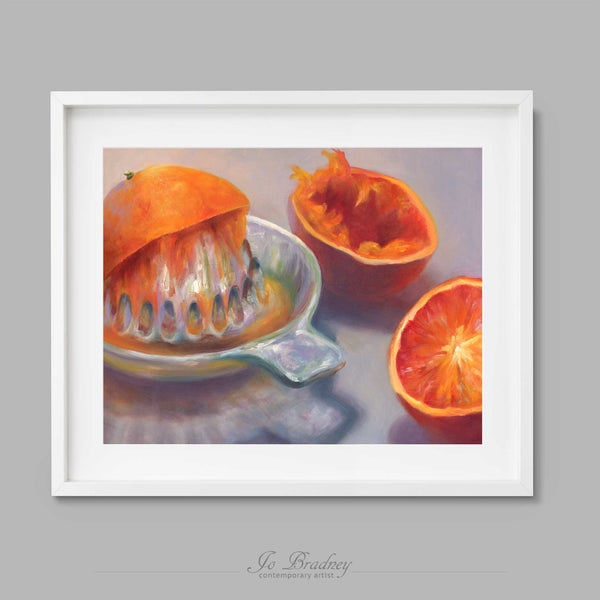 Oranges and an old fashioned glass juicer on a soft lavender gray background. This archival art print of my fruit still life oil painting is shown in simple white picture frame.