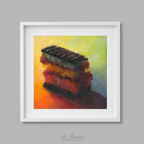 A colorful rainbow spiral background with a chocolate Rainbow Cookie in the center. This archival art print of my cake still life oil painting is shown in simple white picture frame.