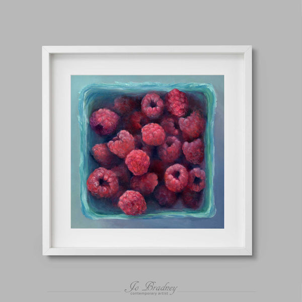 fresh pink summer raspberries in a turquoise berry box. This archival art print of my fruit still life oil painting is shown in simple white picture frame.