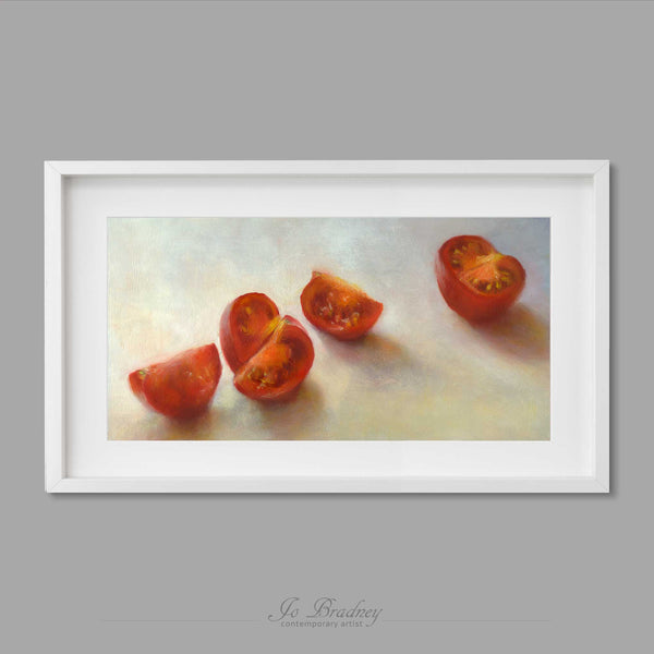 A fresh chopped red tomato scattered ona a white background. This archival art print of my vegetable still life oil painting is shown in simple white picture frame.